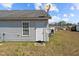View of the backyard with a satellite dish and vinyl siding on the house at 123 Ariel St, Lillington, NC 27546