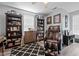 Cozy bedroom featuring a massage chair, bookshelves, and decorative items at 123 Ariel St, Lillington, NC 27546