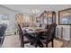 Elegant dining room with a large wooden table, ornate china cabinet, and stylish decor at 123 Ariel St, Lillington, NC 27546