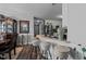 View of kitchen with bar seating, stainless refrigerator and appliances at 123 Ariel St, Lillington, NC 27546