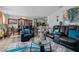 Cozy living room featuring comfortable seating, stylish decor, and an open concept leading to the dining and kitchen areas at 123 Ariel St, Lillington, NC 27546