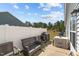 Outdoor patio features a grill, patio furniture, and a white privacy fence at 123 Ariel St, Lillington, NC 27546