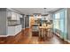 Elegant kitchen with stone backsplash, pantry door, modern appliances, and adjacent dining area offering seamless flow at 147 W Alex Dr, Clayton, NC 27520