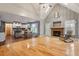 Inviting living room with hardwood floors, stone fireplace, and vaulted ceilings adding architectural interest at 147 W Alex Dr, Clayton, NC 27520