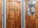 Unique wooden doors adorn the pantry and laundry room, adding rustic charm to the home at 147 W Alex Dr, Clayton, NC 27520