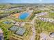 Beautiful aerial view of a planned community with a central lake and tennis courts at 149 Logbridge Rd, Chapel Hill, NC 27516