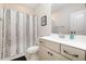 Bathroom featuring a shower with decorative curtain and stylish vanity at 149 Logbridge Rd, Chapel Hill, NC 27516
