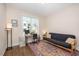 Cozy bedroom with colorful rug and futon, perfect for guests or a home office at 149 Logbridge Rd, Chapel Hill, NC 27516