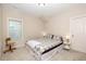 Cozy bedroom featuring neutral walls, a comfortable bed, and a window for natural light at 149 Logbridge Rd, Chapel Hill, NC 27516