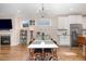 Open-concept dining and kitchen area with modern appliances and a stylish table setup at 149 Logbridge Rd, Chapel Hill, NC 27516