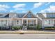 Charming home featuring a cozy front porch and stone accents, set in a welcoming neighborhood at 149 Logbridge Rd, Chapel Hill, NC 27516