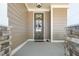 Inviting front porch entrance with a stylish door and stone pillars, creating a welcoming ambiance at 149 Logbridge Rd, Chapel Hill, NC 27516