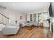 Bright living room featuring hardwood floors and neutral tones, complemented by a cozy fireplace at 149 Logbridge Rd, Chapel Hill, NC 27516