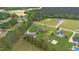 Expansive aerial view of a single-Gathering home on a large lot with mature trees and surrounding greenery at 1500 Antioch Rd, Rocky Mount, NC 27801