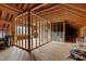 Unfinished attic with exposed wooden beams and a window with lots of natural light at 1500 Antioch Rd, Rocky Mount, NC 27801