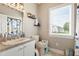 Bathroom with a window, decorative shelves, and sink with a gray countertop at 1500 Antioch Rd, Rocky Mount, NC 27801