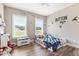 bedroom featuring two windows, wood floors, ceiling fan, and colorful decor at 1500 Antioch Rd, Rocky Mount, NC 27801