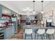 A fully equipped kitchen features stainless steel appliances, grey cabinets and a breakfast bar at 1500 Antioch Rd, Rocky Mount, NC 27801