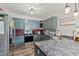 Kitchen features stainless steel appliances, grey cabinets, and stone countertops at 1500 Antioch Rd, Rocky Mount, NC 27801