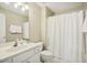 Clean and well-maintained bathroom featuring neutral tones, a vanity, and a shower-tub combination at 1515 Poets Glade Dr, Apex, NC 27523