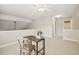 Well-lit bedroom featuring a desk, chair, and neutral tones, perfect for a cozy study or guest room at 1515 Poets Glade Dr, Apex, NC 27523