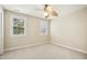 Inviting bedroom with a ceiling fan and natural light streaming through two windows at 1515 Poets Glade Dr, Apex, NC 27523