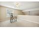 Bright bedroom features a desk and chair, enhanced by natural light and neutral decor at 1515 Poets Glade Dr, Apex, NC 27523