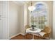 Cozy breakfast nook featuring hardwood floors, a modern light fixture, and a large arched window at 1515 Poets Glade Dr, Apex, NC 27523