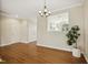 Charming dining room featuring hardwood floors and a view through to the adjacent kitchen space at 1515 Poets Glade Dr, Apex, NC 27523