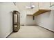 Clean garage with overhead storage and ample space for vehicles and organization at 1515 Poets Glade Dr, Apex, NC 27523