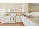 Kitchen featuring white cabinets and stainless steel appliances at 1515 Poets Glade Dr, Apex, NC 27523
