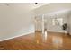 Bright living room features hardwood floors, fireplace, and column at 1515 Poets Glade Dr, Apex, NC 27523