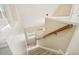 Carpeted staircase with wood railing leading to the upper level of the home at 1515 Poets Glade Dr, Apex, NC 27523