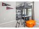 A small bedrom featuring bunk bed, desk and shelving unit, with decorative pennants at 1725 Langlais Dr, Graham, NC 27253