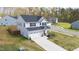 Beautiful two-story home featuring a two car garage, long driveway and manicured front lawn at 1725 Langlais Dr, Graham, NC 27253