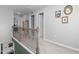 Upstairs hallway with neutral walls, carpet, and doorways leading to various rooms in the home at 1725 Langlais Dr, Graham, NC 27253