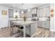 Modern kitchen featuring a large island, granite countertops, and stainless steel appliances at 1725 Langlais Dr, Graham, NC 27253