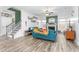 Bright living room features a fireplace, modern decor, and plank flooring, creating an inviting space at 1725 Langlais Dr, Graham, NC 27253