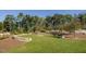Beautiful backyard with manicured lawn, stone accents, and a serene, park-like setting at 173 Hawk Point Rd, Chapel Hill, NC 27516