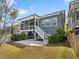 Relaxing backyard with screened porch, concrete patio, and grassy area; great for outdoor entertaining at 173 Hawk Point Rd, Chapel Hill, NC 27516