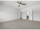 Large bedroom showcasing carpet, ceiling fan, closet, and bathroom access at 173 Hawk Point Rd, Chapel Hill, NC 27516