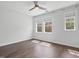 Bright bedroom featuring two large windows, and hardwood floors at 173 Hawk Point Rd, Chapel Hill, NC 27516