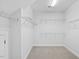 Walk in closet with wire shelving and carpet at 173 Hawk Point Rd, Chapel Hill, NC 27516