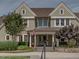 Inviting clubhouse entrance with American flag, flower pots, and stone steps at 173 Hawk Point Rd, Chapel Hill, NC 27516