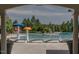 Community pool with umbrella tables, lounge chairs and lifeguard stand for safety at 173 Hawk Point Rd, Chapel Hill, NC 27516
