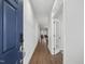 Elegant entryway featuring dark wood floors, white walls, and a view of the living area at 173 Hawk Point Rd, Chapel Hill, NC 27516