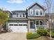 Charming two-story home with a two-car garage, inviting front porch, and manicured landscaping at 173 Hawk Point Rd, Chapel Hill, NC 27516