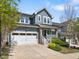 Charming two-story home with a two-car garage, inviting front porch, and manicured landscaping at 173 Hawk Point Rd, Chapel Hill, NC 27516