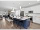 Open-concept kitchen with a large island, stainless steel appliances, and seamlessly connected to the dining and living area at 173 Hawk Point Rd, Chapel Hill, NC 27516