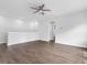 Open living room with hard wood floors, white walls and recessed lighting at 173 Hawk Point Rd, Chapel Hill, NC 27516